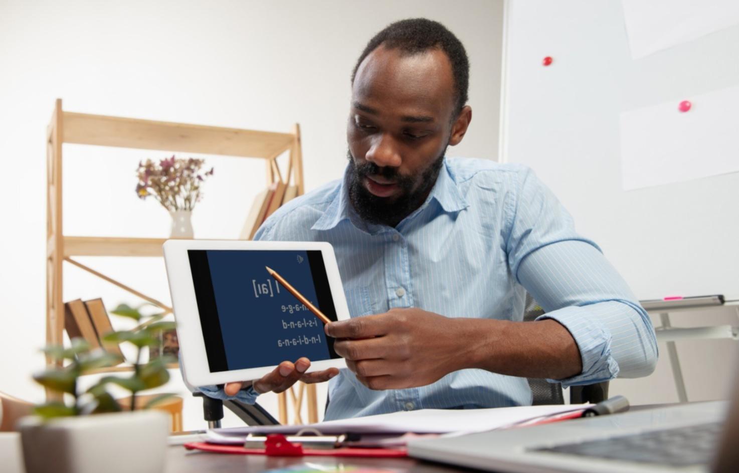 Collaborative workspace showing financial charts and data analysis on multiple screens